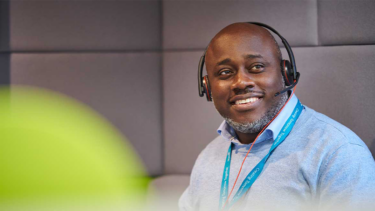 a man smiling because Wates is Disability Confident